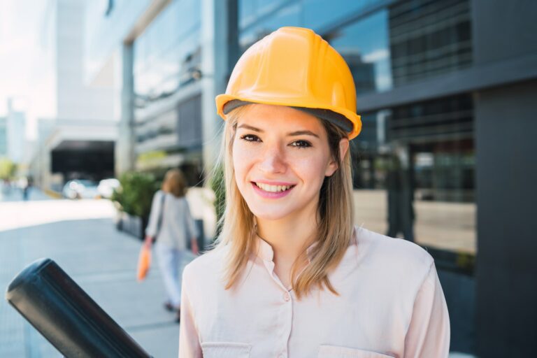 Professional architect woman standing outdoors.